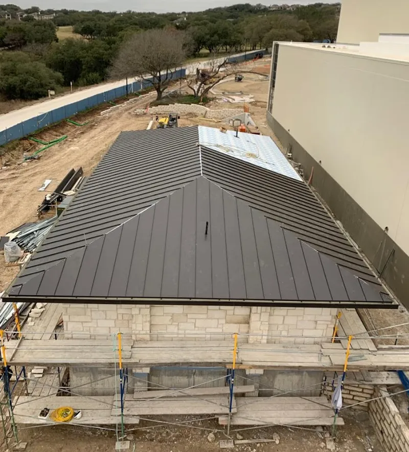 Metal roof new construction with scaffolding in Derry